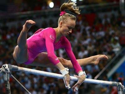 Nastia Liukin of the United States performs on the uneven bars during gymnastics artistic women's individual all-round final of Beijing 2008 Olympic Games at National Indoor Stadium in Beijing, China, Aug. 15, 2008. Liukin claimed the title of the event with a score of 63.325. (Xinhua/Ren Long)