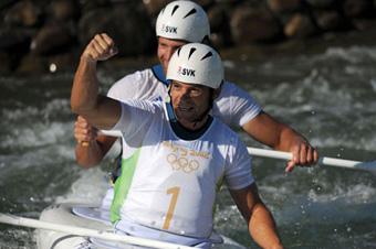 Pavol Hochschorner (front) and Peter Hochschorner of Slovakia react after finishing the canoe double (C2) men final at the Beijing Olympic Games Canoe/Kayak Slalom event in Beijing, China, Aug. 15, 2008. Pavol Hochschorner and Peter Hochschorner won the gold medal of the event. (Xinhua/Liu Dawei)