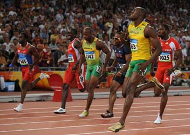 Jamaica's Usain Bolt (R) wins the men's 100m final at the National Stadium as part of the 2008 Beijing Olympic Games on August 16, 2008.