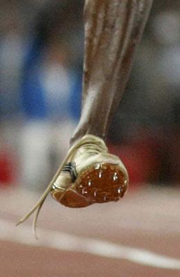 The shoe of Usain Bolt of Jamaica is seen untied after winning the men's 100m final of the athletics competition in the National Stadium at the Beijing 2008 Olympic Games August 16, 2008. Bolt won 100 metres gold at the Beijing Olympics in a world record time on Saturday, running 9.69 seconds to claim victory in an exhilarating showdown with his compatriot Asafa Powell.