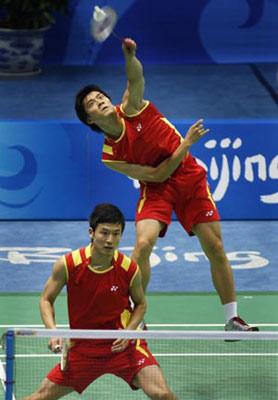 Cai Yun and Fu Haifeng (back) of China compete with Markis Kido and Hendra Setiawan of Indonesia at the men's doubles gold medal match of the Beijing 2008 Olympic Games badminton event, in Beijing, China, Aug. 16, 2008.(Xinhua Photo)