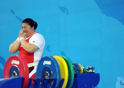 Jang Miran of South Korea celebrates during women's +75kg group A competition of the Beijing 2008 Olympic Games weightlifting event in Beijing, China, Aug. 15, 2008. Jang Miran set the new world record of women's +75kg with a total of 326kg and claimed the gold. (Xinhua Photo)