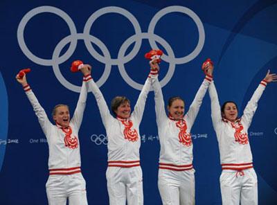 Russia's fencers pose on the podium after winning the gold of Women's Team Foil of the Beijing 2008 Olympic Games fencing event in Beijing, China, Aug. 16, 2008.(Xinhua Photo)