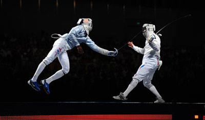 Boris Sanson of France competes with Keeth Smart of US during men's team sabre gold medal match of Beijing 2008 Olympic Games fencing event at Fencing Hall in Beijing, China, Aug. 17, 2008. France beat US 45-37 and won the gold medal.(Xinhua Photo)