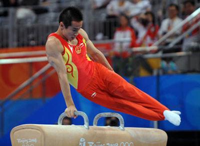 China's Xiao Qin performs on the pommel horse during the men's apparatus final of Beijing 2008 Olympic Games at National Indoor Stadium in Beijing, China, Aug. 17, 2008. Xiao Qin claimed the title of the event with a score of 15.875. (Xinhua/Cheng Min)