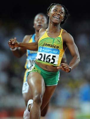 Shelly-Ann Fraser (Front) of Jamaica reacts after winning in women's 100m final at the National Stadium, also known as the Bird's Nest, during Beijing 2008 Olympic Games in Beijing, China, Aug. 17, 2008. Shelly-Ann Fraser claimed the title of the event.(Xinhua Photo)