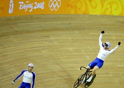 Chris Hoy (R) of Great Britain celebrates after victory in the Men’s Keirin Finals of the cycling-track event during the Beijing 2008 Olympic Games at the Laoshan Velodrome in Beijing, China, Aug. 16, 2008. Chris Hoy won the gold medal. (Xinhua Photo)