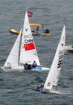 The British team (R) competes during the Yngling medal race at the Beijing 2008 Olympic Games sailing event at Qingdao Olympic Sailing Center in Qingdao, an-Olympic co-host city in eastern China’s Shandong Province, Aug. 17, 2008. The British team won the gold medal of the event. (Xinhua/Song Zhenping)