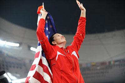 Stephanie Brown Trafton of the United States celebrates after the women's discus throw final at the National Stadium, also known as the Bird's Nest, during Beijing 2008 Olympic Games in Beijing, China, Aug. 18, 2008. Trafton won the gold with 64.74 metres. (Xinhua Photo)
