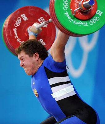Andrei Aramnau of Belarus tries a lift during men's 105 kg group A match of Beijing 2008 Olympic Games Weightlifting event in Beijing, China, Aug. 18, 2008. Andrei Aramnau set the new world record of the men's 105 kg with a total of 436 kg and won the gold in the event.(Xinhua/Yang Lei) 