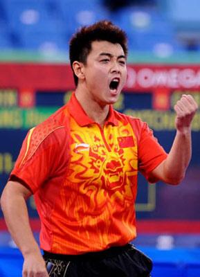 Wang Hao of China celebrates after defeating Dimitrij Ovtcharov of Germany during the men's team gold medal contest between China and Germany of Beijing Olympic Games table tennis event in Beijing, China, Aug. 18, 2008. China beat Germany 3-0 and claimed the title in this event. (Xinhua Photo)