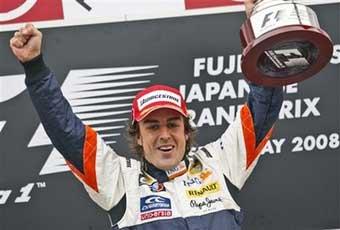 Renault driver Fernando Alonso of Spain celebrates on the podium after winning the Formula One Japanese Grand Prix at the Fuji Speedway circuit, in Oyama, Japan, Sunday, Oct. 12, 2008.(AP Photo)