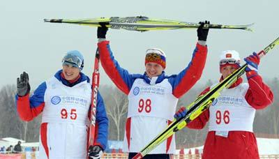 Gold medalist Aleksey Tchernousov (C), silver medalist Sergey Turychev (L) and bronze medalist Konstantin Glavatskikh of Russia celebrate after the men's 10km free individual cross-country skiing finals at the 24th World Winter Universiade in the Yabuli Ski Resort, 195km southeast away from Harbin, capital of northeast China's Heilongjiang Province, Feb. 20, 2009. (Xinhua/Gesang Dawa)