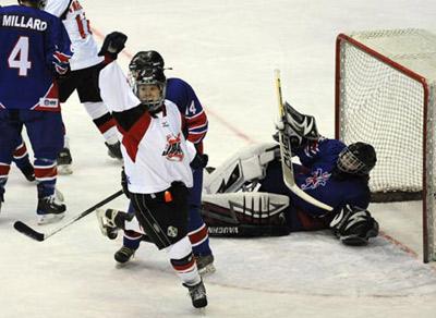 Players of Japan celebrate a score during the women's play-off round match of ice hockey against Great Britain in the 24th World Winter Universiade at Harbin Ice Hockey Gym in Harbin, capital of northeast China's Heilongjiang Province, Feb. 24, 2009. Japan won 10-0 and took the 5th in the event. (Xinhua/Yang Lei)