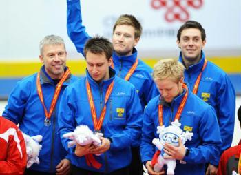 Players and coach of Sweden react during the awarding ceremony for men's curling in the 24th World Winter Universiade at Harbin, capital city of northeast China's Heilongjiang Province, Feb. 27, 2009. Sweden beat Norway 8-7 in the final and claimed the title of the event. (Xinhua/Chen Kai)