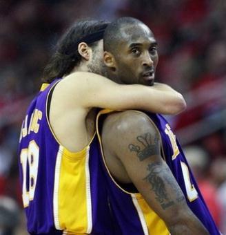 Kobe Bryant (right) and Sasha Vujacic of the Los Angeles Lakers celebrate a three-point shot at the end of the 3rd quarter against the Houston Rockets in Game Three of the Western Conference Semifinals during the 2009 NBA Playoffs at Toyota Center, in Houston, Texas. The Lakers won 108-94 to take a 2-1 series lead.(AFP/Getty Images/Ronald Martinez)
