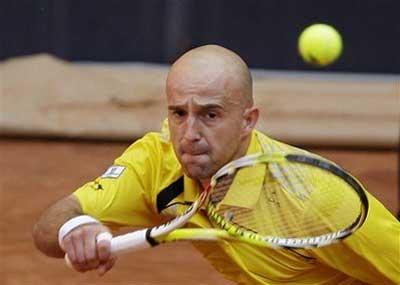 Ivan Ljubicic of Croatia returns the shot to Jo-Wilfried Tsonga of France during the Madrid Open Tennis in Madrid, on Tuesday, May 12, 2009. Ljubicic won 6-4, 7-5. (AP Photo/Victor R. Caivano) 