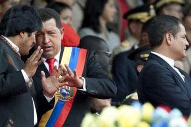Boliva's President Evo Morales (L), Venezuela's President Hugo Chavez (C) and Ecuador's President Rafael Correa attend a military parade to celebrate the 188th anniversary of the battle of Carabobo in Valencia, some 180 km (112 miles) west from Caracas June 24, 2009.REUTERS/Carlos Garcia Rawlins