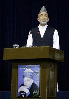 Presidential candidate and current President Hamid Karzai delivers his speech during an election rally in Kabul, Afghanistan, Friday, July 24, 2009. Afghanistan's president shook hands and roused supporters Friday with promises to hold international troops more accountable during his first campaign rally in the capital.