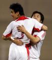 2006年10月11日，中國隊球員孫祥（左）進球後與隊友慶祝。當日，中國隊在約旦阿卜杜拉國王體育場舉行的亞洲盃足球預選賽E組比賽中，以2比0擊敗巴勒斯坦隊，獲得小組出線。 新華社發